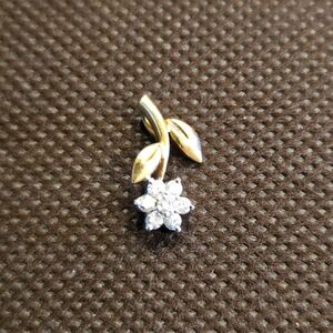 Vintage 14k gold diamond flower pendant.